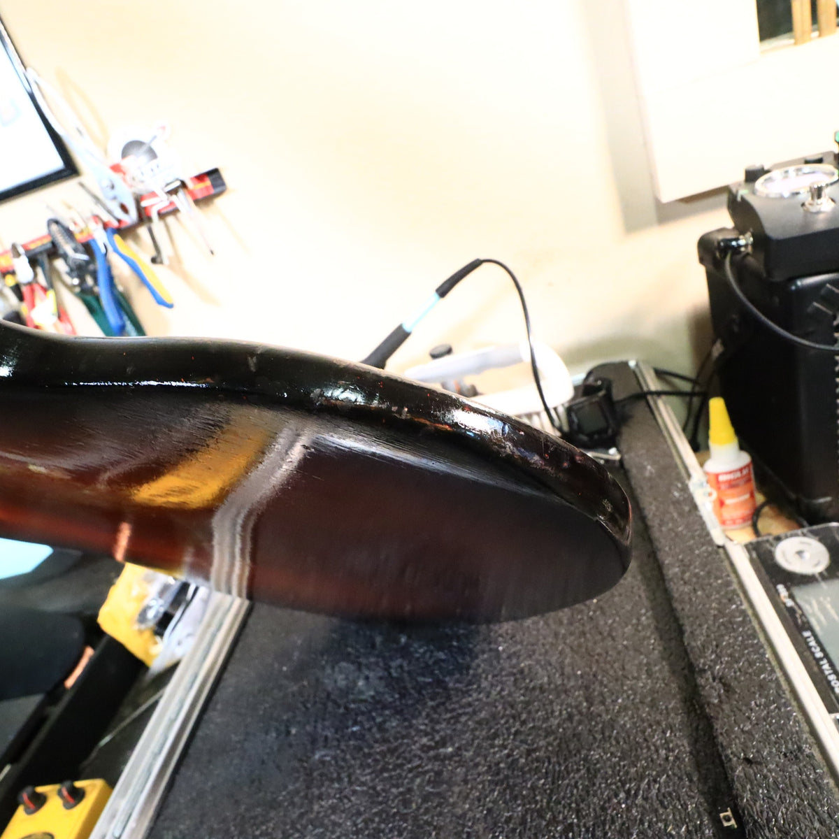 Close-up of the body edge showing paint wear and finish condition.