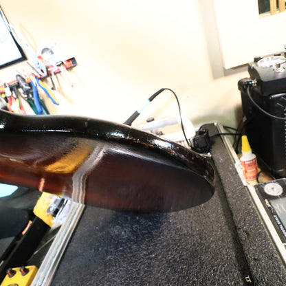 Close-up of the body edge showing paint wear and finish condition.