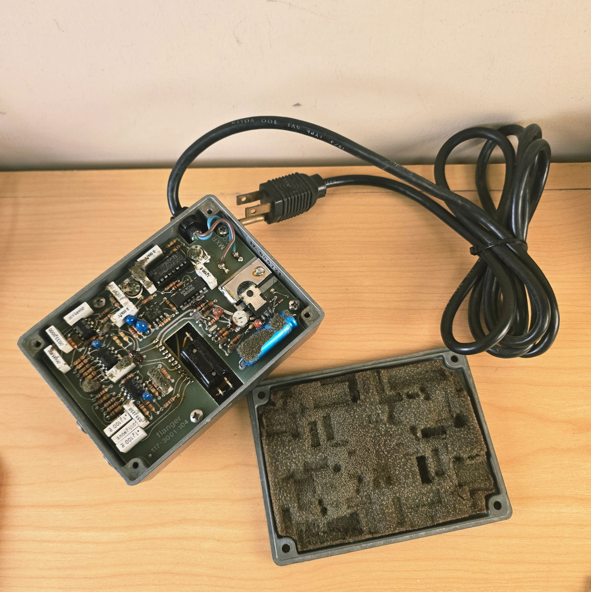 Internal view of MXR Flanger showing circuit board and degraded bottom plate foam.