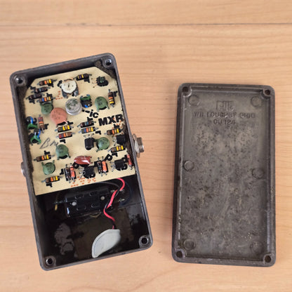 Interior view showing the circuit board with metal-can IC and the interior of the Bud box backplate.