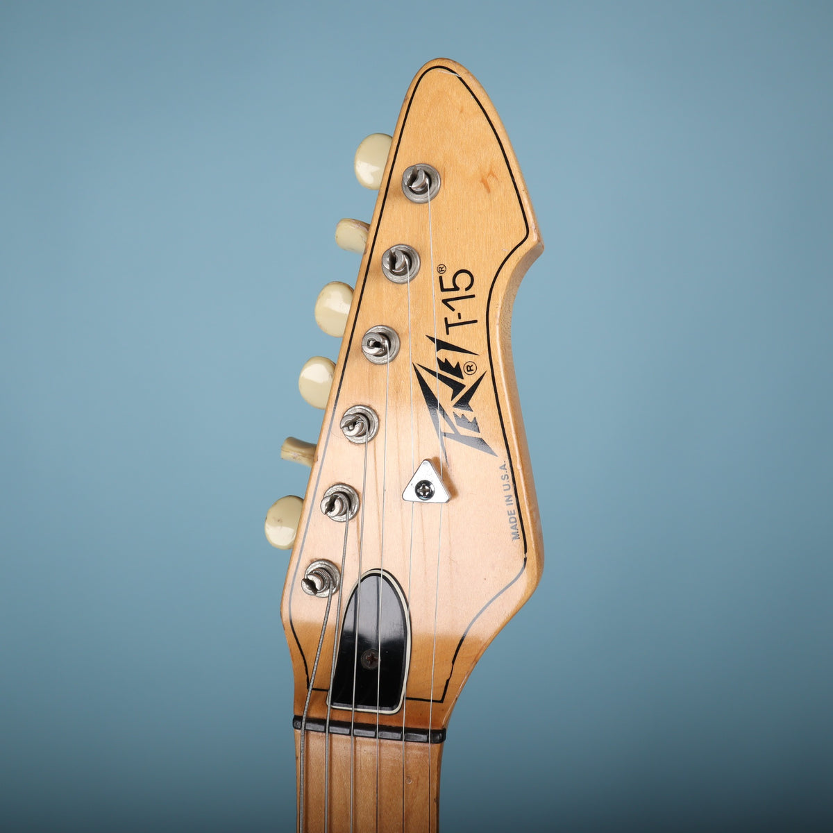 Front face of the Peavey T-15 headstock showing logo and Made in USA text.