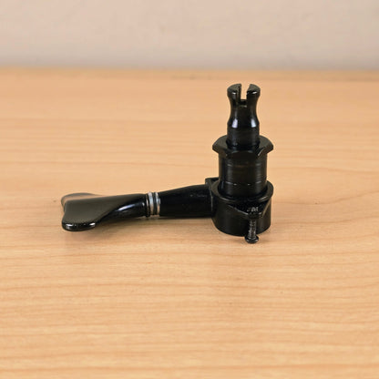 Profile view of the tuning peg laying horizontally with mounting screw alongside