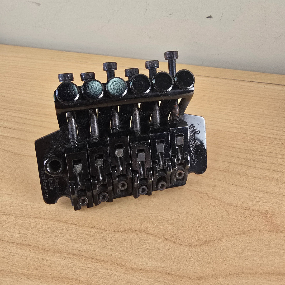 Perspective top view of black Jackson tremolo assembly