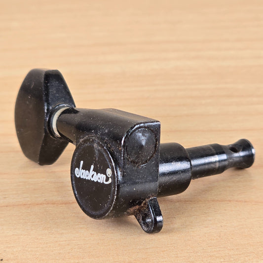Perspective view of the black Jackson tuner showing the post and mounting tab.