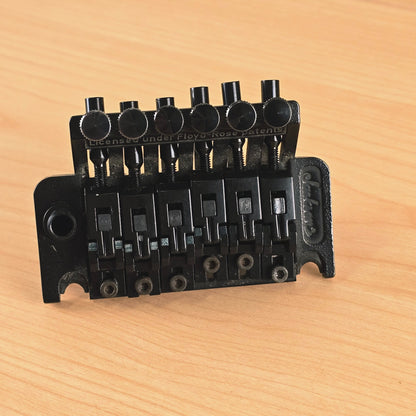 Overhead view showing the bridge assembly, saddles, and knife edges.