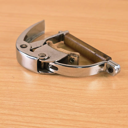Angled close-up of the Hamilton KB19A capo highlighting the felt-lined neck rest.