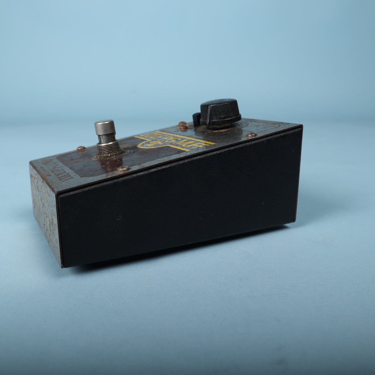 Side profile showing the wedge-shaped angled steel enclosure.
