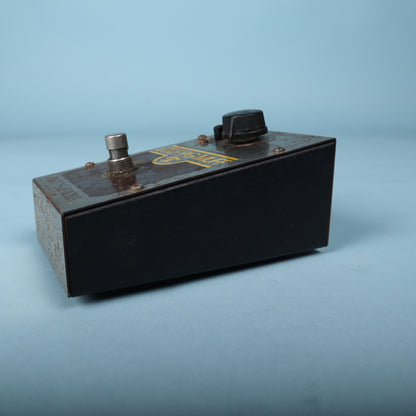 Side profile showing the wedge-shaped angled steel enclosure.