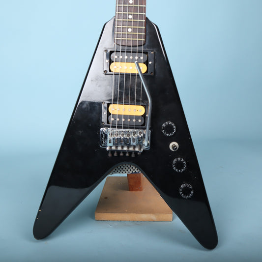Front view of the 1986 Epiphone V2 electric guitar body in black.