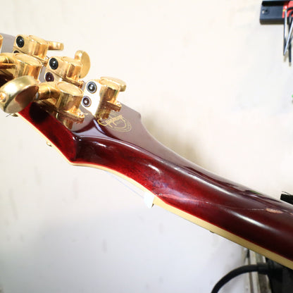 Rear body view of guitar resting on tech bench