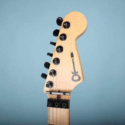 Headstock of Charvel electric guitar showing logo and tuners