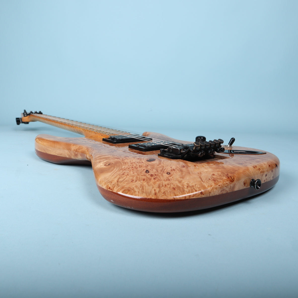 Profile view along the lower horn of the guitar body.