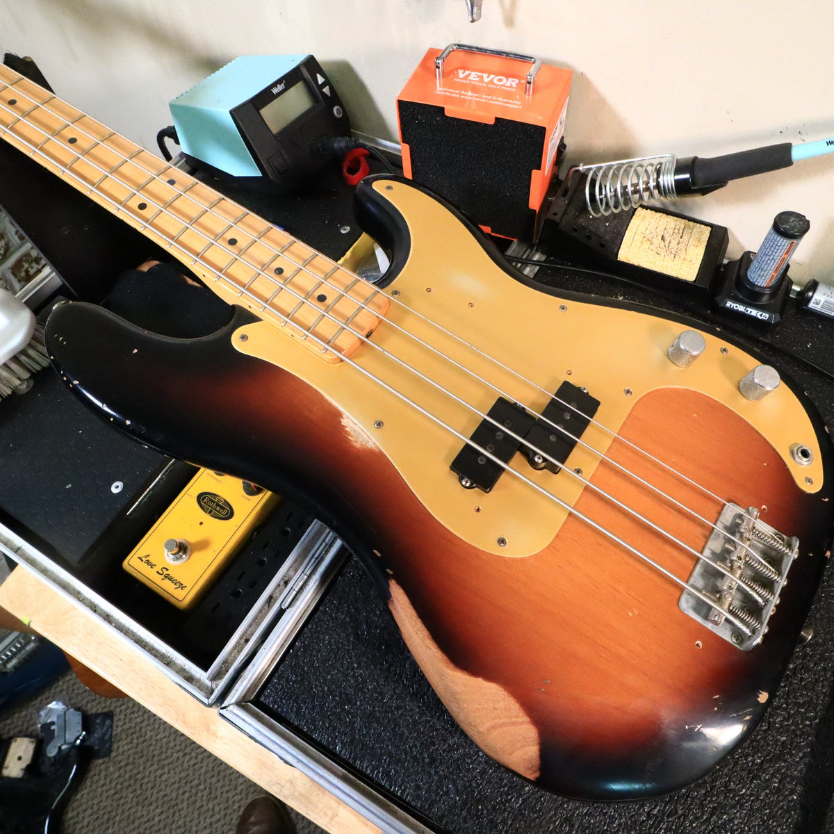 Fender Road Worn Precision Bass on a workbench showing the body and lower neck.