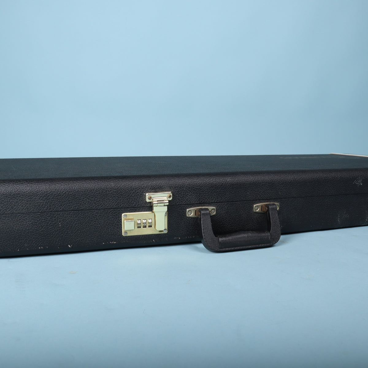 Tobias hardshell bass guitar case combination lock and handle closeup