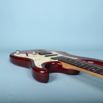 Front body of Ibanez Blazer guitar resting on workbench during inspection.