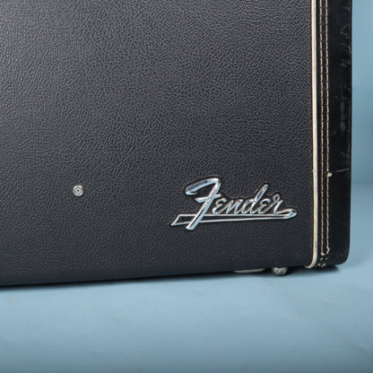 Close-up of chrome Fender script logo on black hardshell case