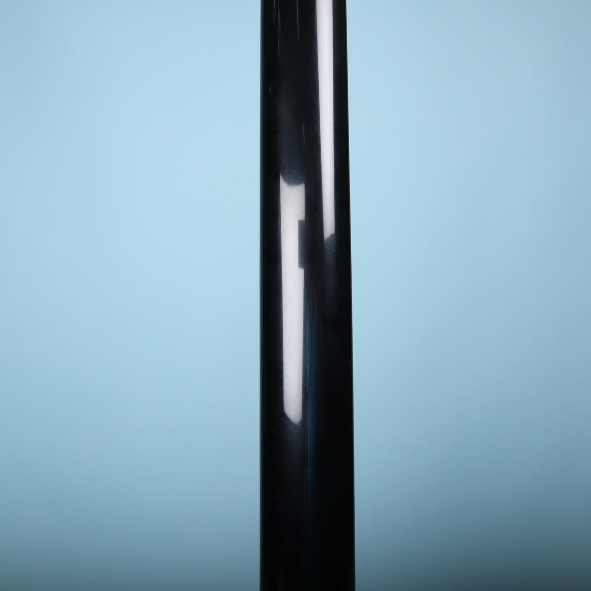Close-up of the back of the neck finished in gloss black