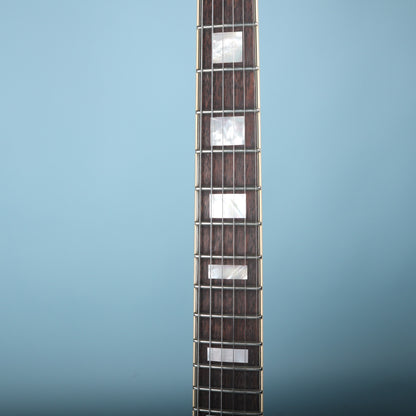 Close-up of the bound fretboard with white block inlays on the Premier Mini DC.