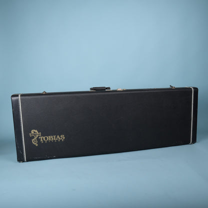 Tobias hardshell bass guitar case exterior showing gold Tobias Guitars logo