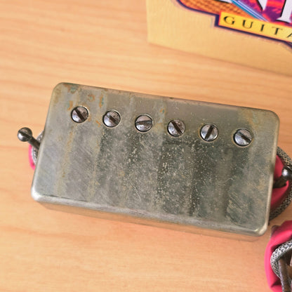 Close-up view of Seymour Duncan Antiquity bridge humbucker cover and pole screws