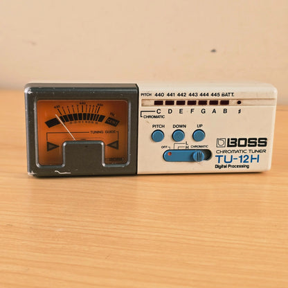 Top-down direct view of the Boss TU-12H faceplate, LED lights, and push-button controls.