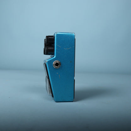 Left profile view showing the audio output jack and enclosure wear