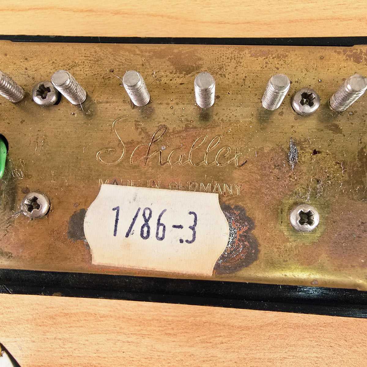 Detailed view of Schaller Made in Germany engraving and 1/86-3 date code label
