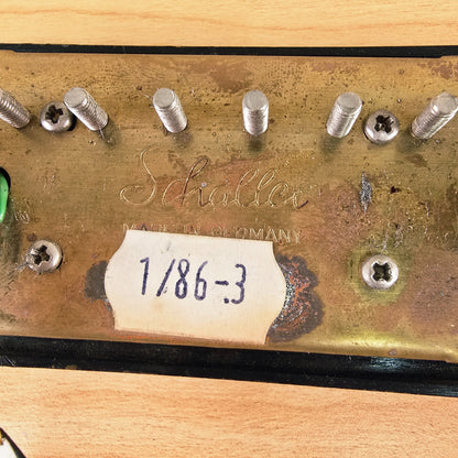 Detailed view of Schaller Made in Germany engraving and 1/86-3 date code label