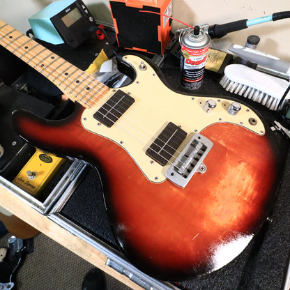 Peavey T-15 guitar body resting flat on a technician bench.