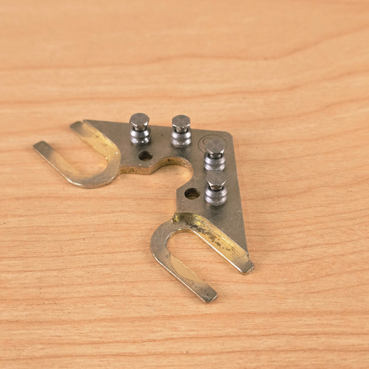 Angled front view of String Butler V3 showing roller posts and mounting arms