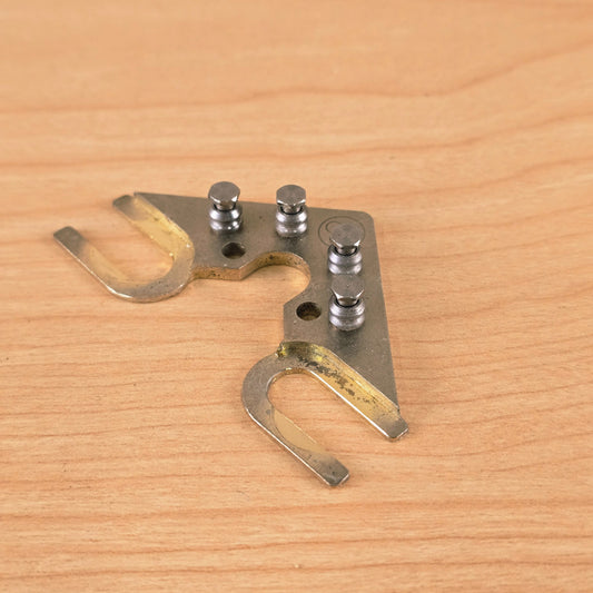 Angled front view of String Butler V3 showing roller posts and mounting arms