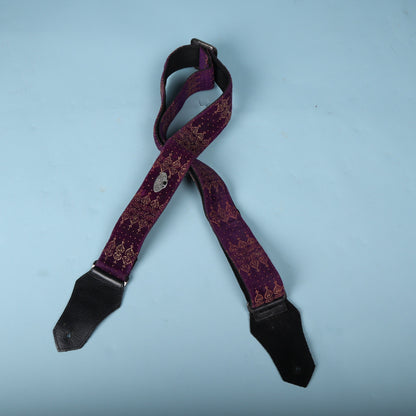 Front view of the folded Get'm Get'm Indochine purple velvet guitar strap