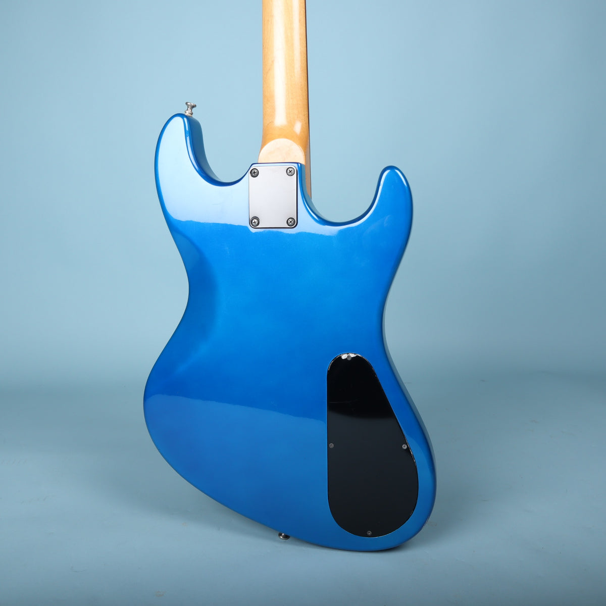 Back of the metallic blue body featuring the black neck plate and control cover