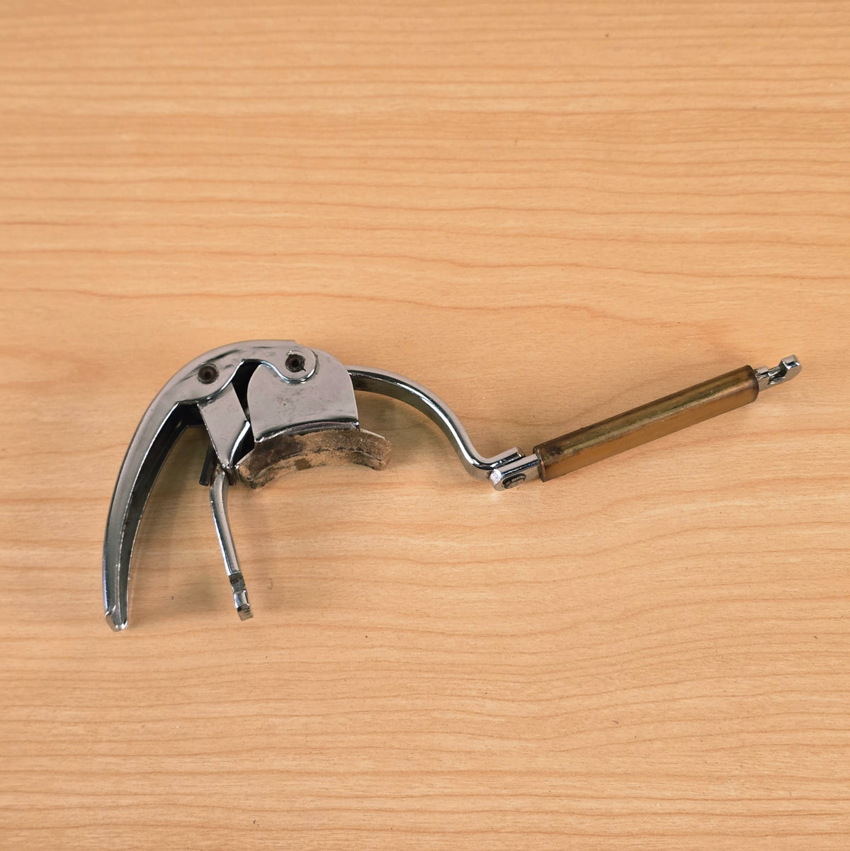 Underside angle of the open Hamilton KB19A capo showing the neck rest pad.