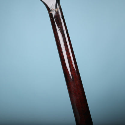 Back of the mahogany neck showing the gloss finish and wood grain.