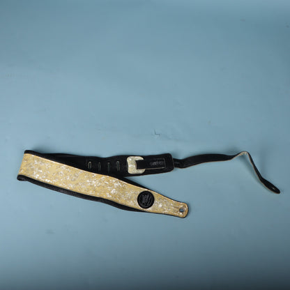 View of the strap folded with the ladder adjustment slots and model stamp visible.