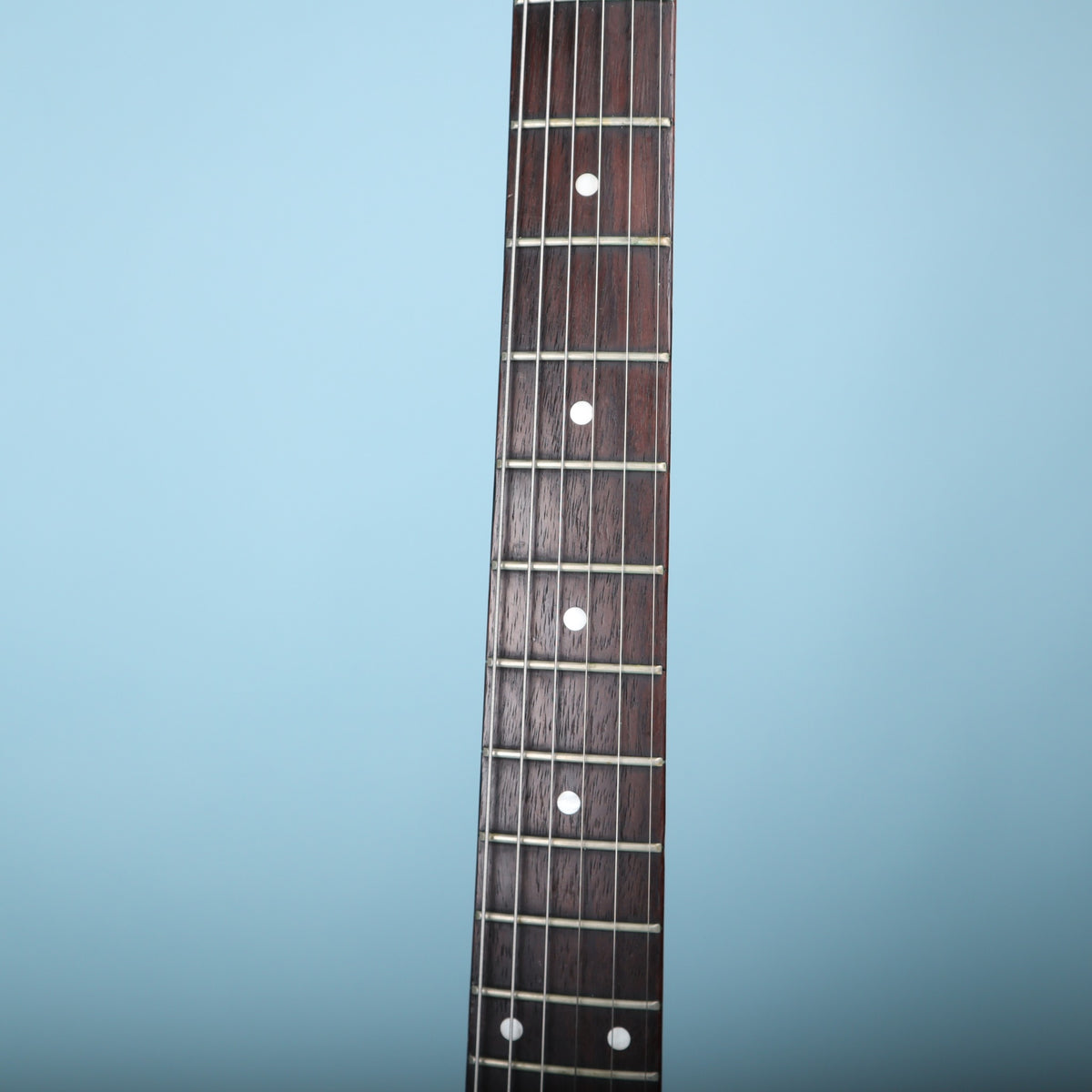 Rosewood fretboard with dot inlays on the Epiphone V2 neck.